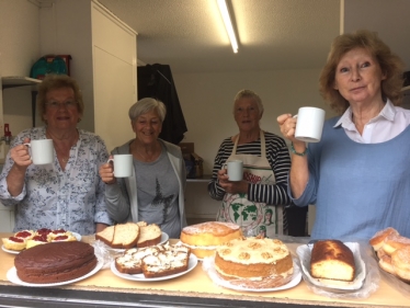 The ladies from the Totnes Constituency CWO serving tea and cake in Dartmouth's Royal Avenue Gardens