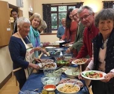 Attendees line up for a buffet lunch